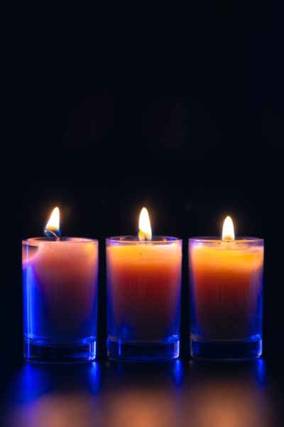 burning-candle-black-background-with-backlight-memorial-day