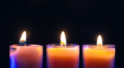 burning-candle-black-background-with-backlight-memorial-day